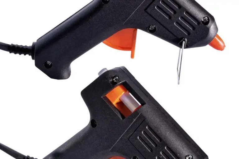 Close-up image of two black and orange hot glue guns