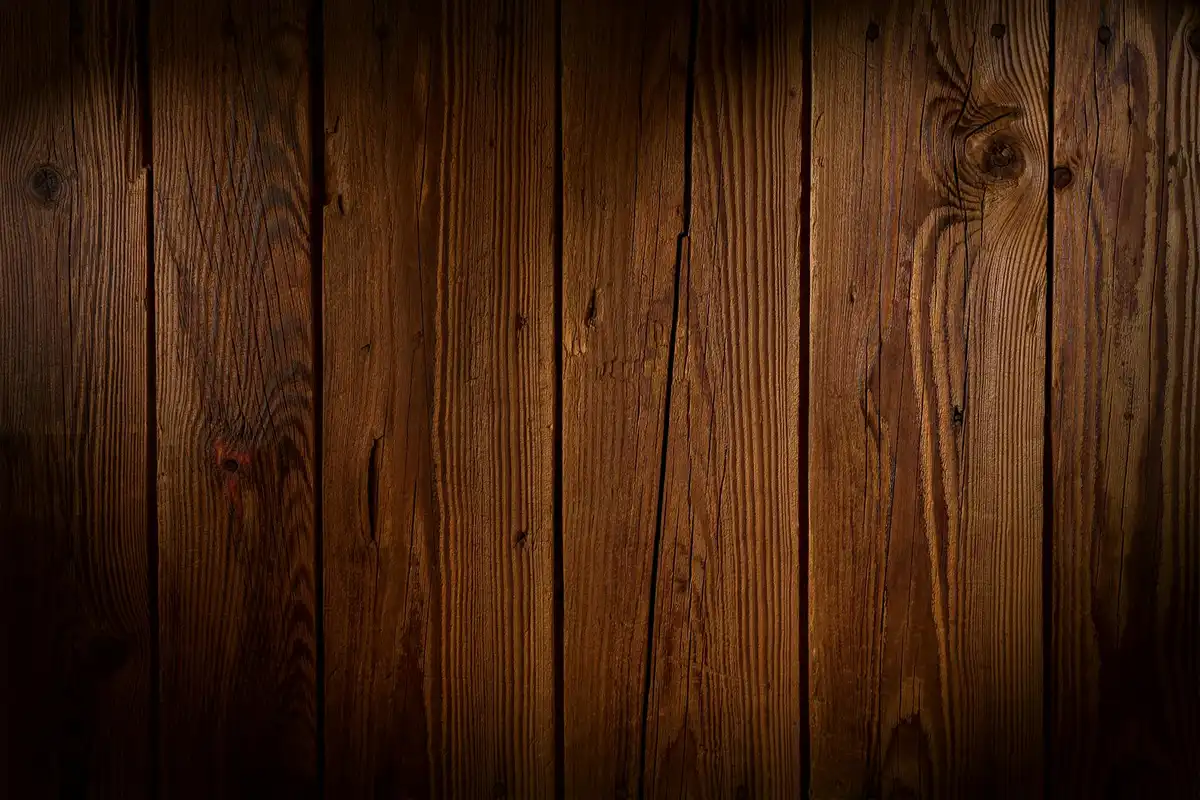 Close-up of vertical Ipe wood planks with rich grain and warm brown color.