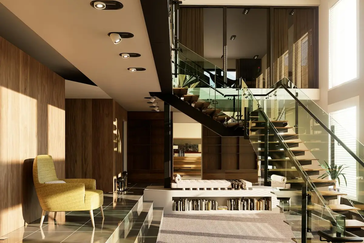 Modern living room with warm wood paneling, a glass staircase, and natural light.