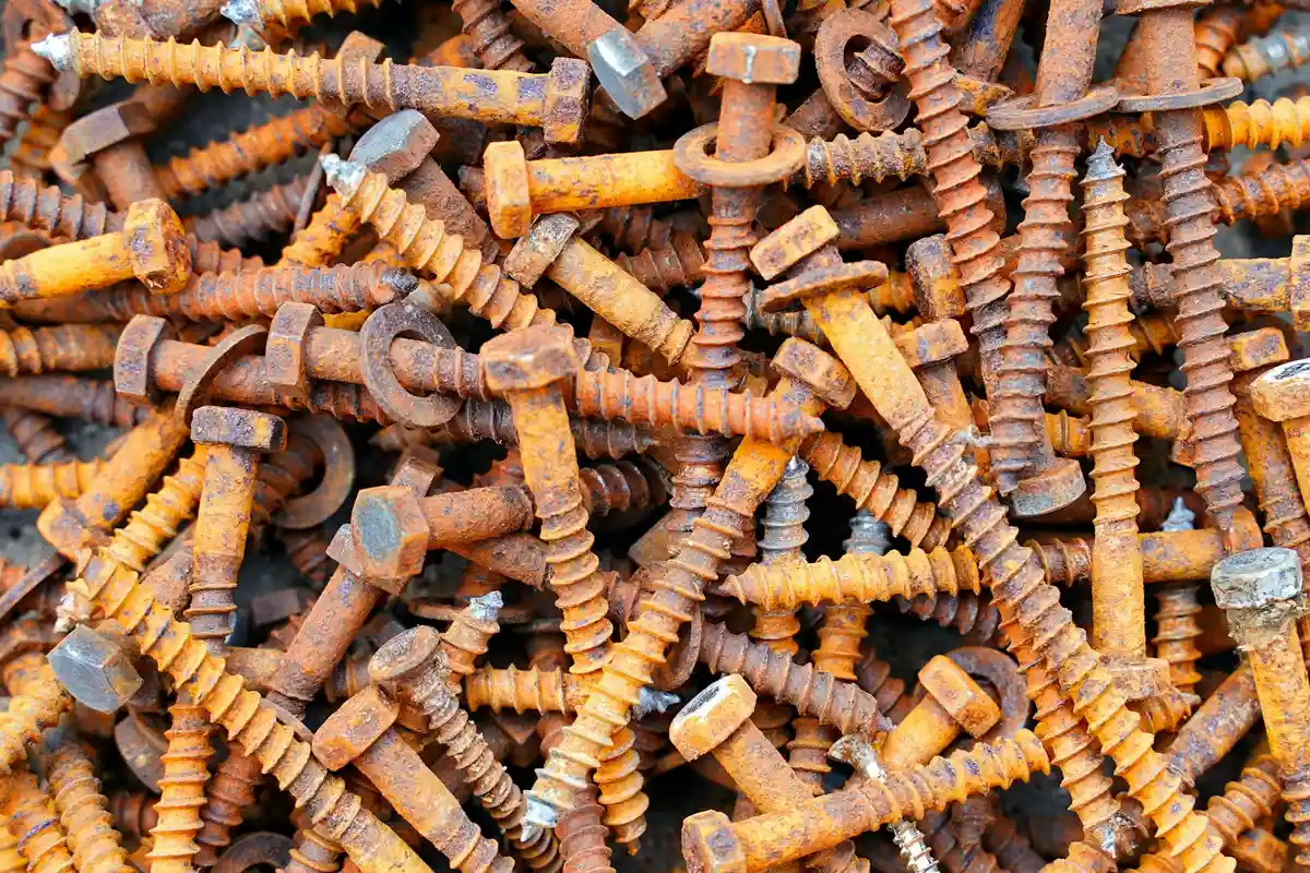 Pile of rusted screws and bolts scattered together