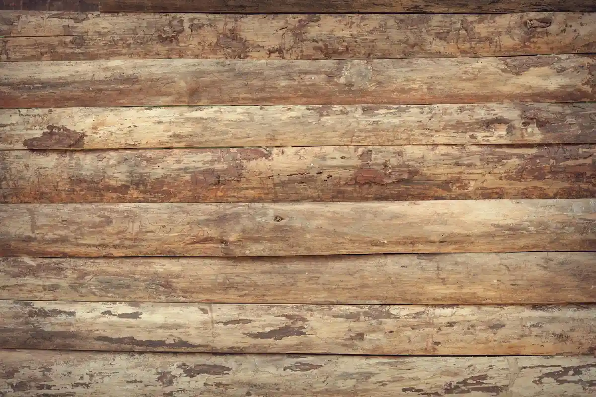 Rows of weathered wooden planks with varied colors and grain patterns.