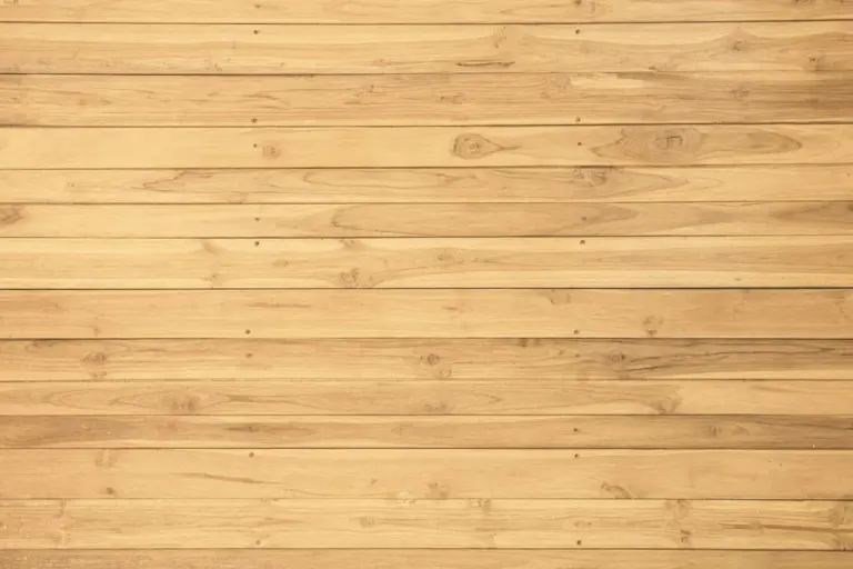Row of light-colored horizontal wooden planks with visible grain patterns