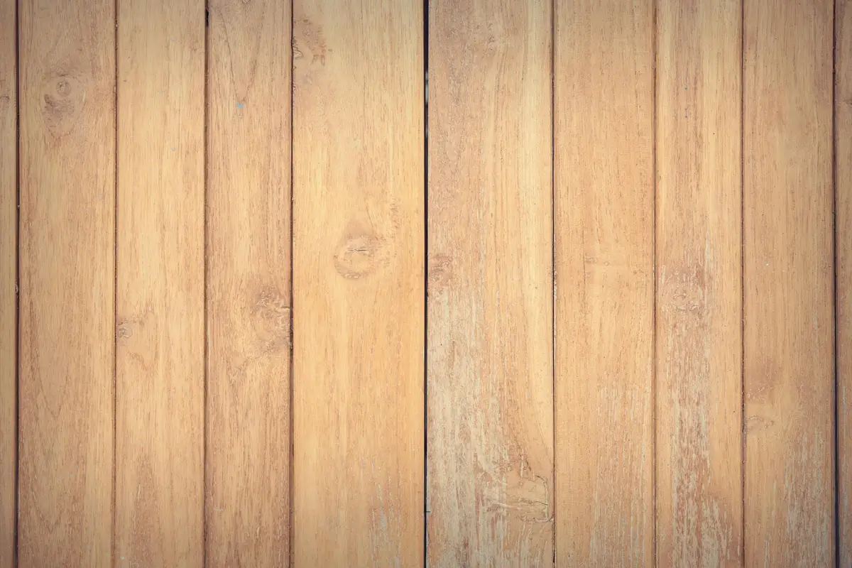 Close-up of vertical wooden planks with warm, natural tones.