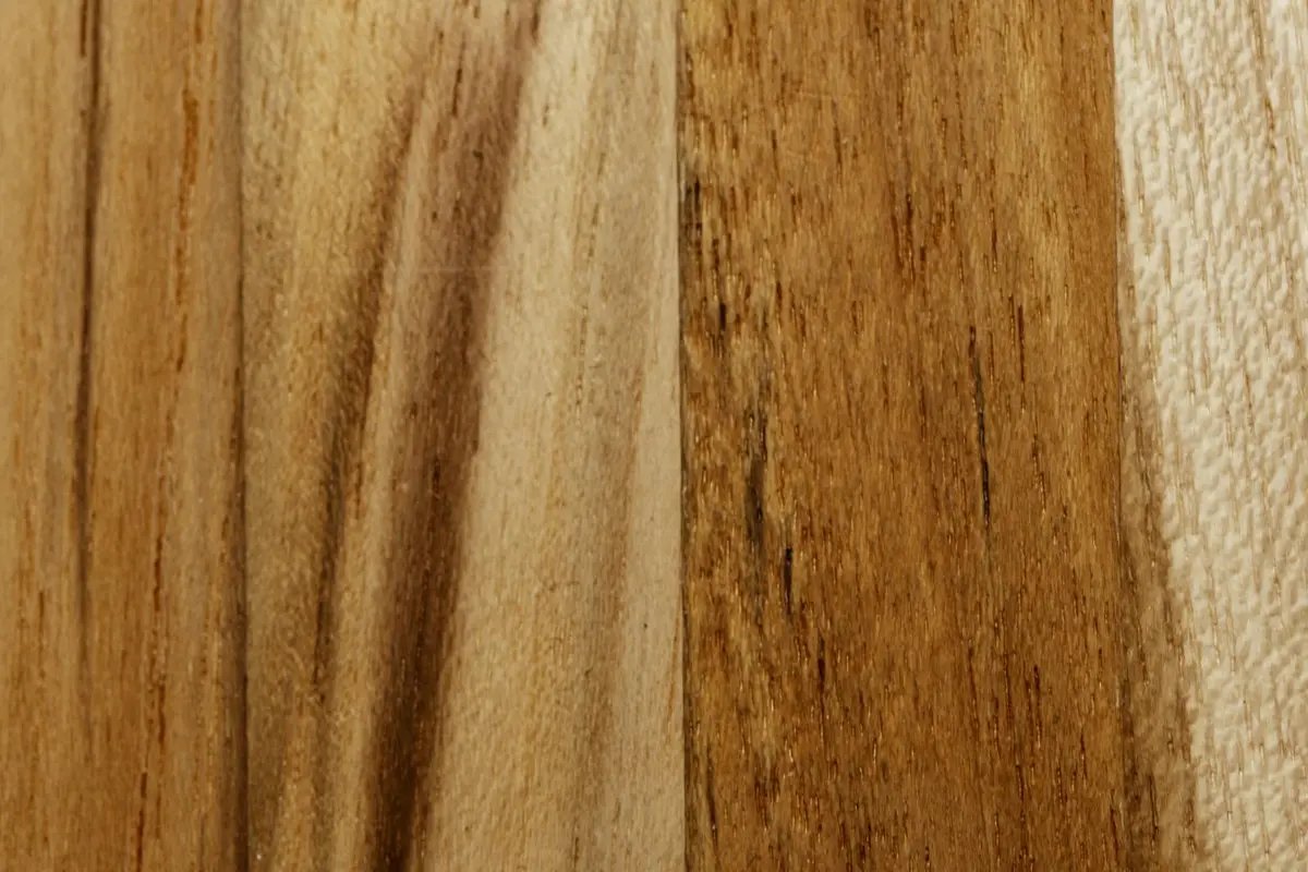 Close-up of wood veneer panels with varying grain patterns and warm tones.
