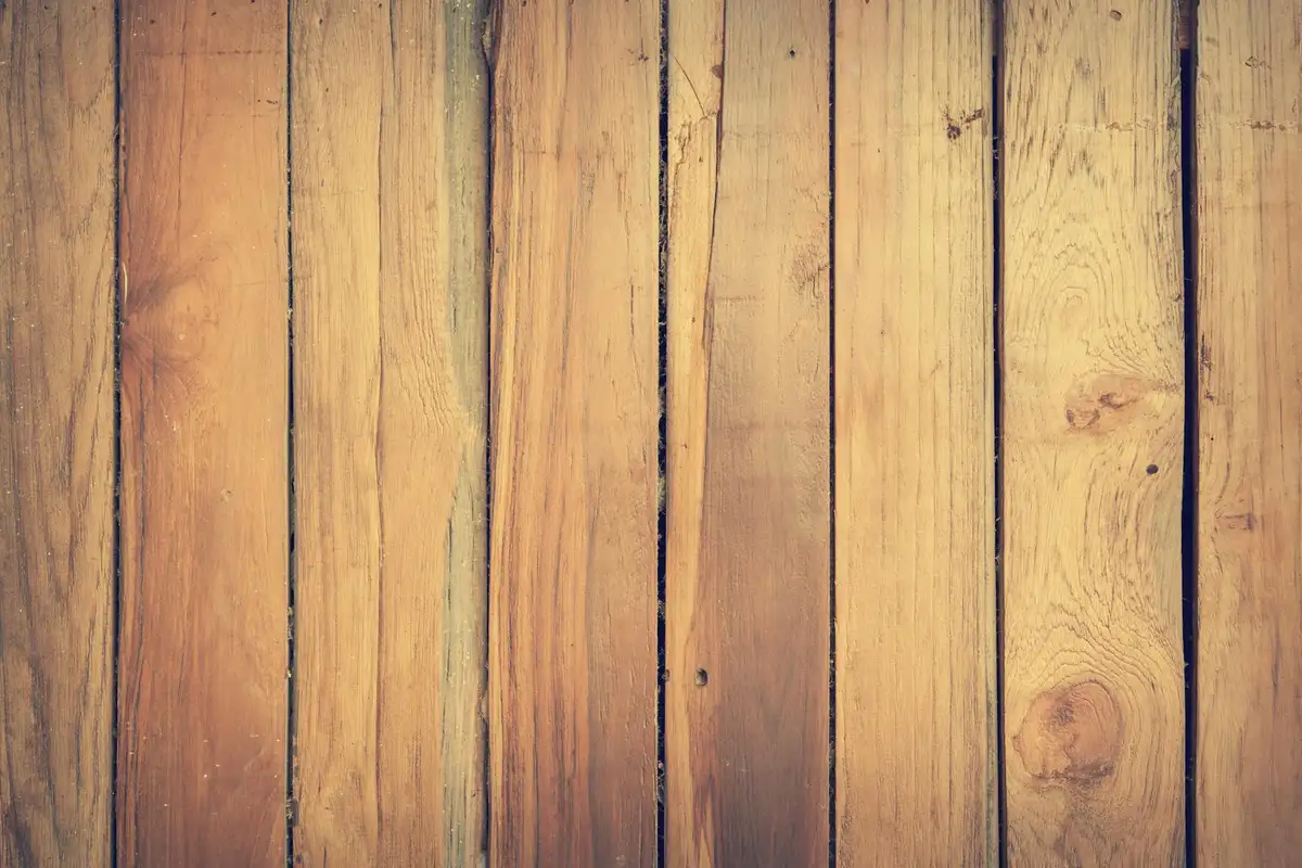 Close-up of vertical wooden planks showing grain patterns and knots.