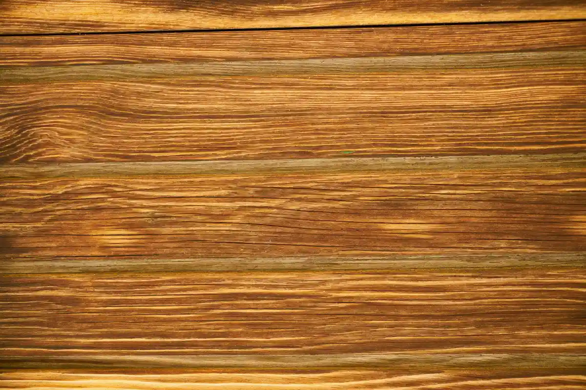Close-up view of horizontal wooden planks with rich grain patterns and warm brown tones
