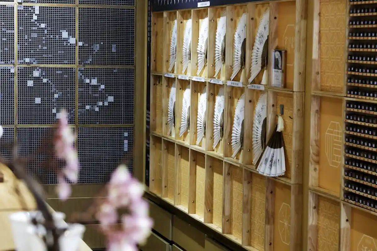 Wall-mounted display of wood samples and veneer swatches in a showroom