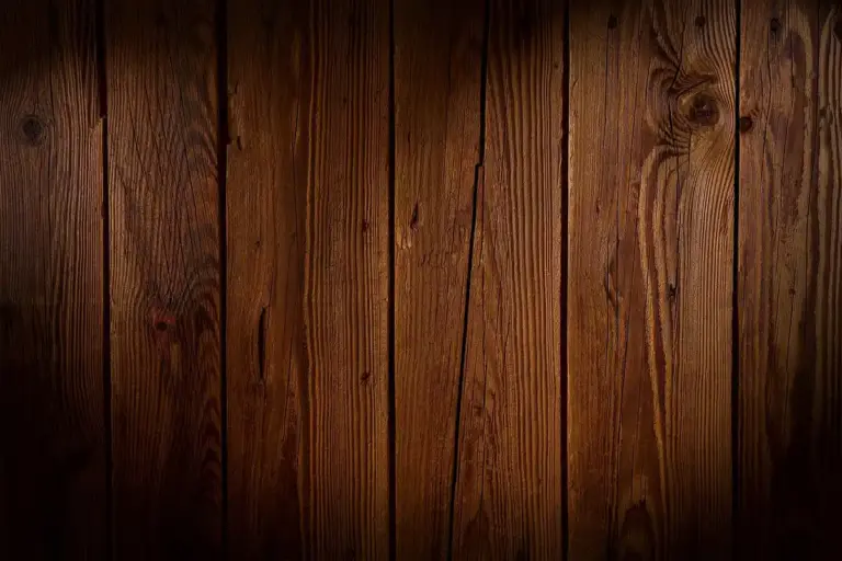 Dark brown wooden planks arranged vertically with visible grain